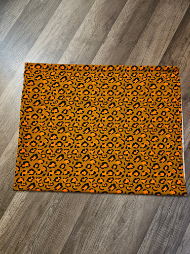 1 yard Orange Leopard on Brown Swim Fabric | Blue Moon Fabrics